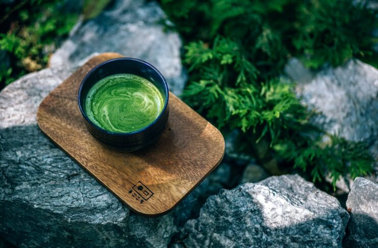 photo of matcha drink on a wooden tray